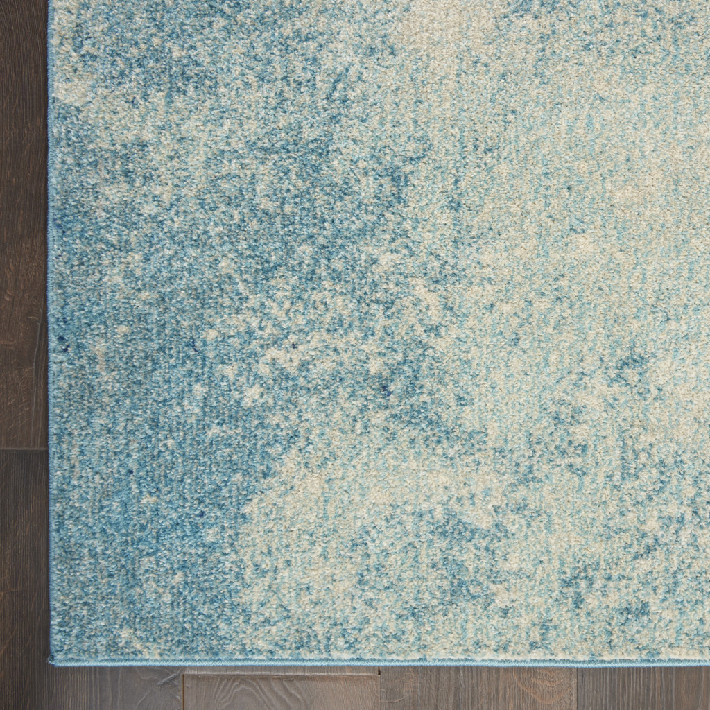 7" X 10" Ivory And Blue Abstract Power Loom Area Rug