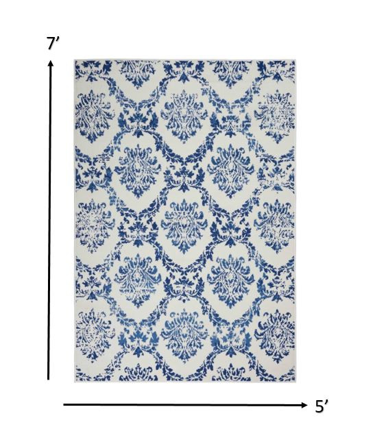 5" X 7" Blue And Ivory Floral Dhurrie Area Rug