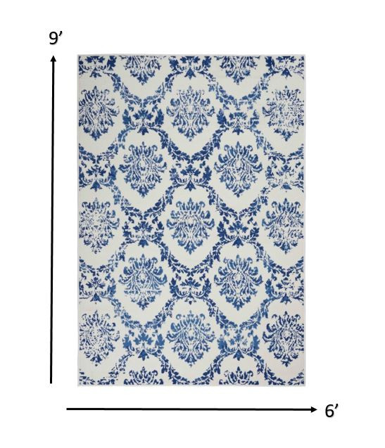 6" X 9" Blue And Ivory Floral Dhurrie Area Rug
