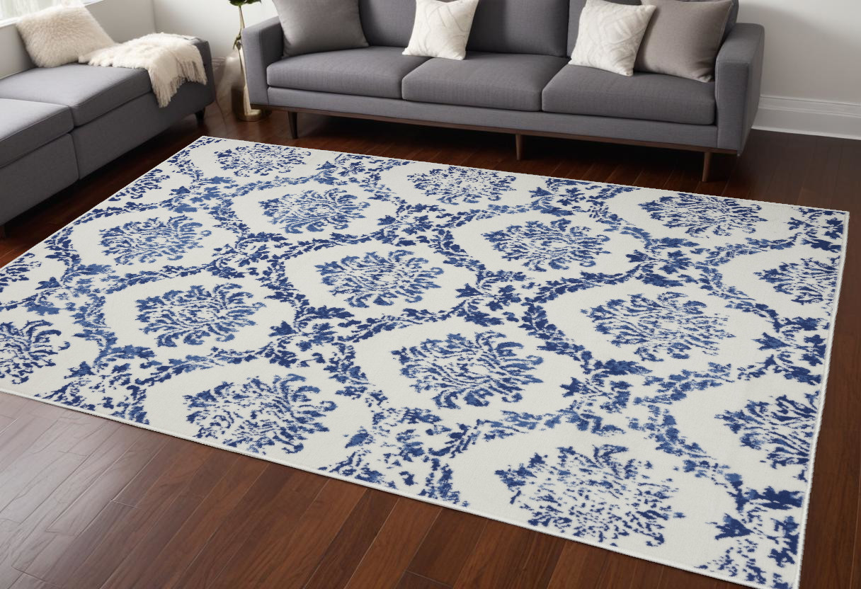 6" X 9" Blue And Ivory Floral Dhurrie Area Rug