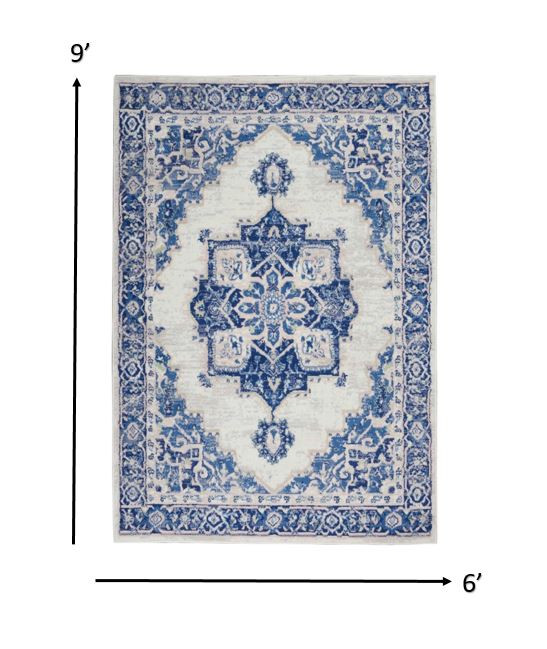 6" X 9" Blue And Ivory Floral Dhurrie Area Rug