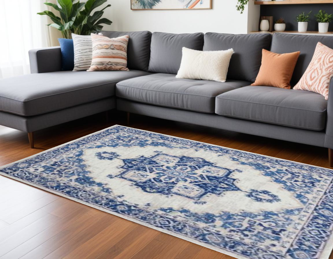 6" X 9" Blue And Ivory Floral Dhurrie Area Rug