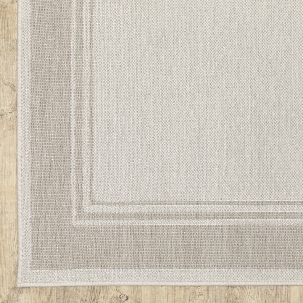 7x9 Ivory and Gray Bordered Indoor Outdoor Area Rug