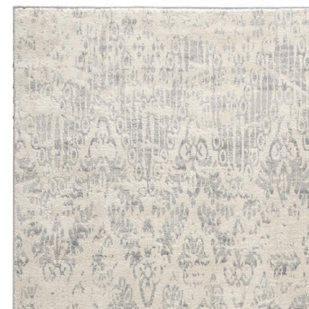 2" X 5" Ivory and Gray Ikat Power Loom Distressed Area Rug