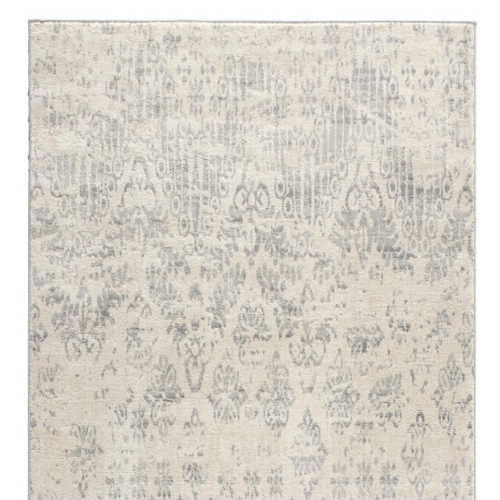 2" X 5" Ivory and Gray Ikat Power Loom Distressed Area Rug