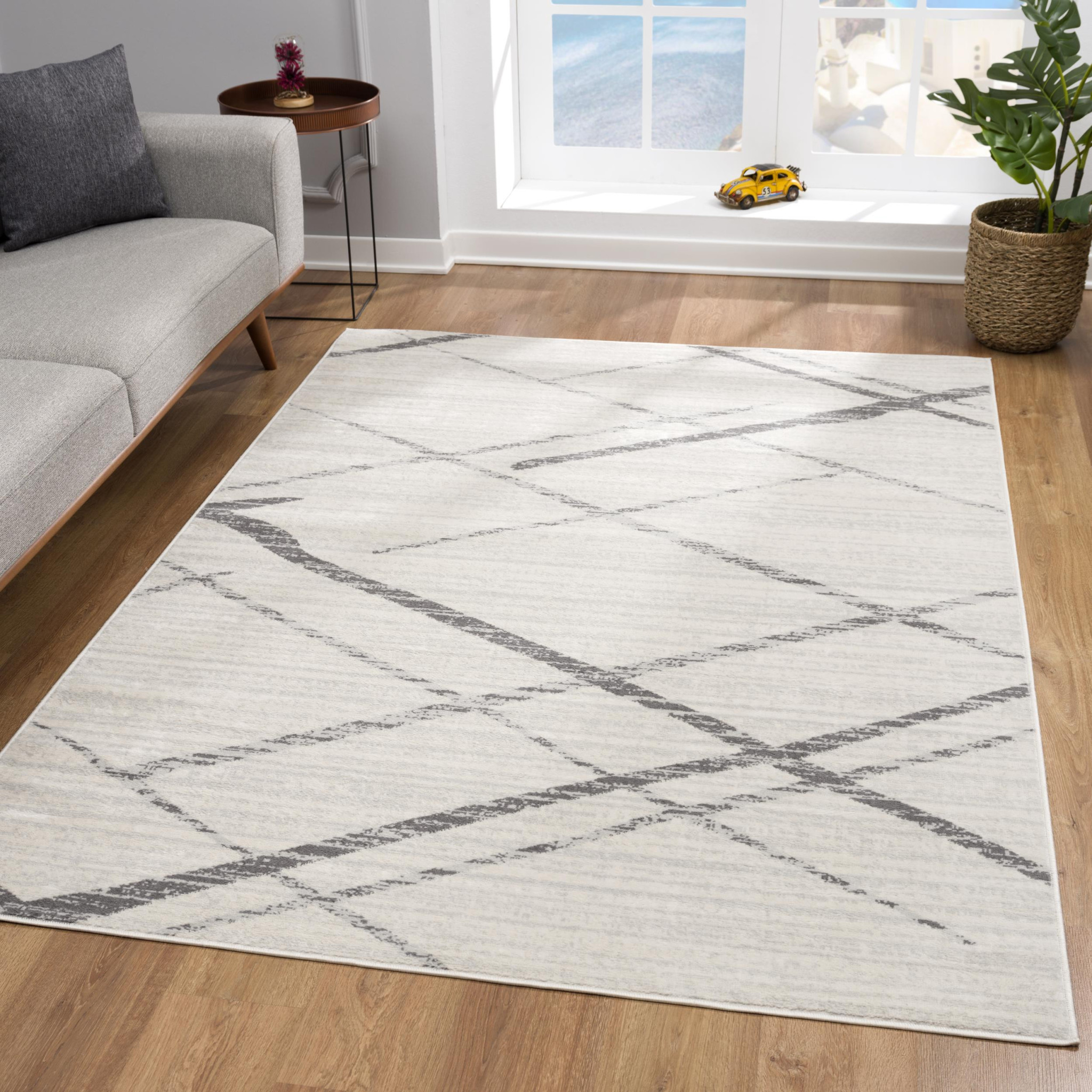6" X 9" Gray and Ivory Geometric Area Rug