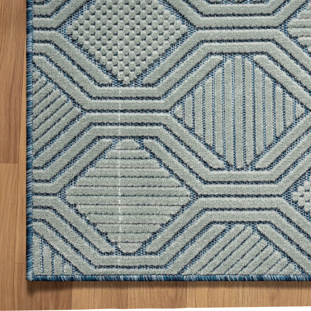 5" X 7" Light Blue And Navy Geometric Stain Resistant Area Rug