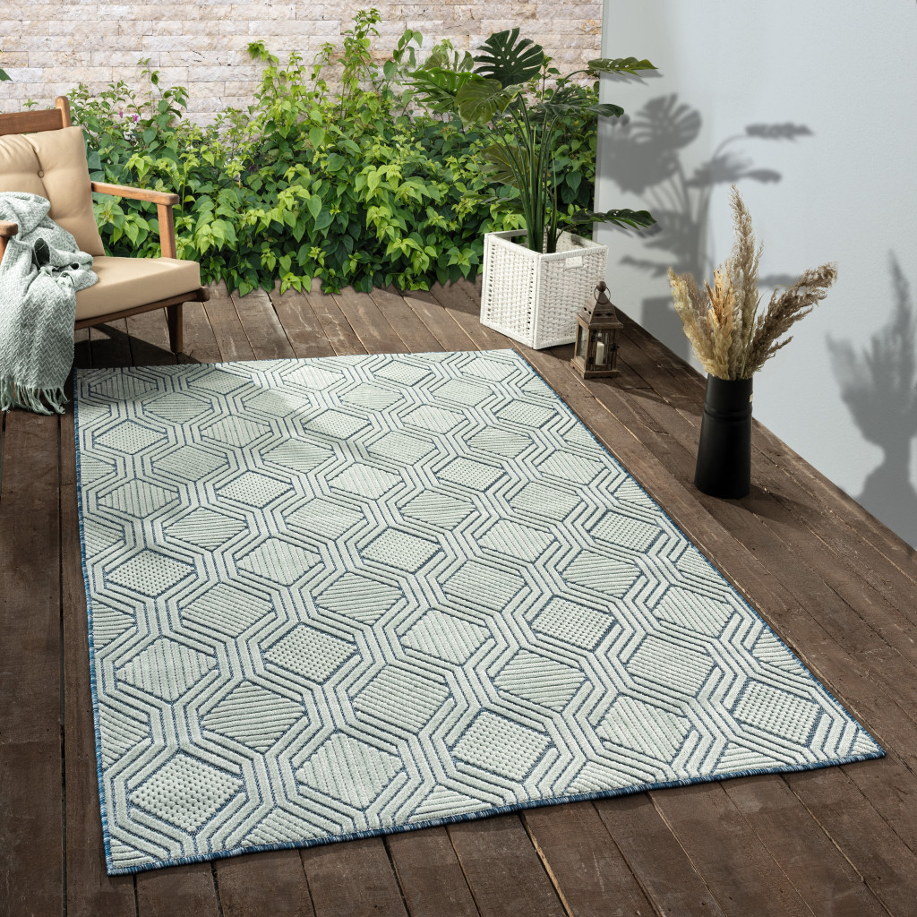 5" X 7" Light Blue And Navy Geometric Stain Resistant Area Rug