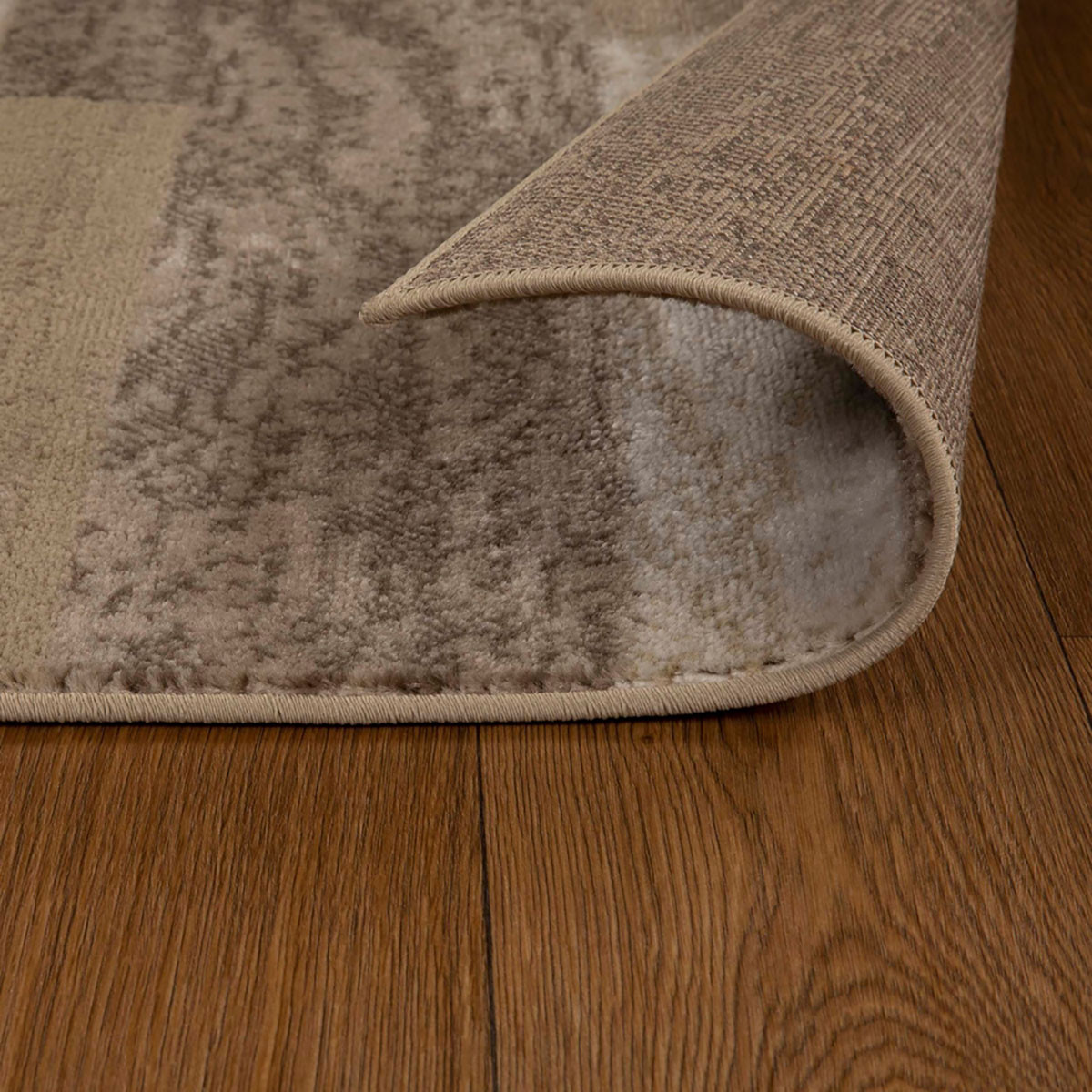 7" X 9" Beige Patchwork Power Loom Stain Resistant Area Rug