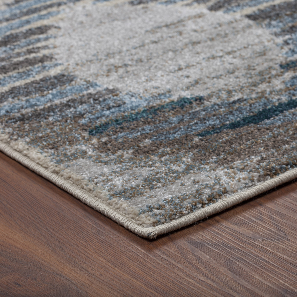 5" X 8" Blue and Ivory Geometric Area Rug