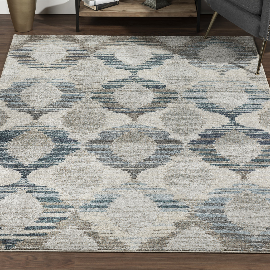 5" X 8" Blue and Ivory Geometric Area Rug