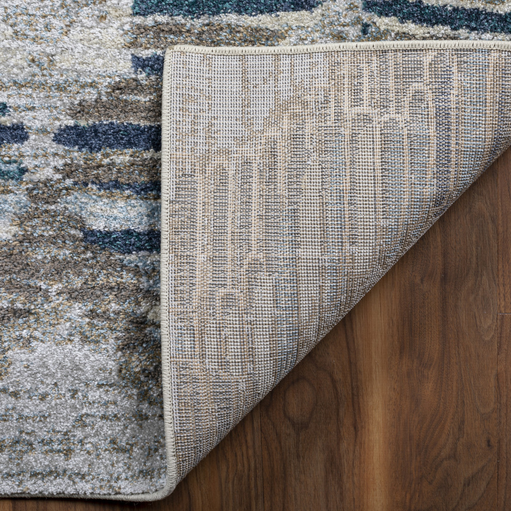 5" X 8" Blue and Ivory Geometric Area Rug