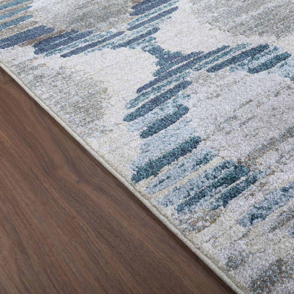 5" X 8" Blue and Ivory Geometric Area Rug