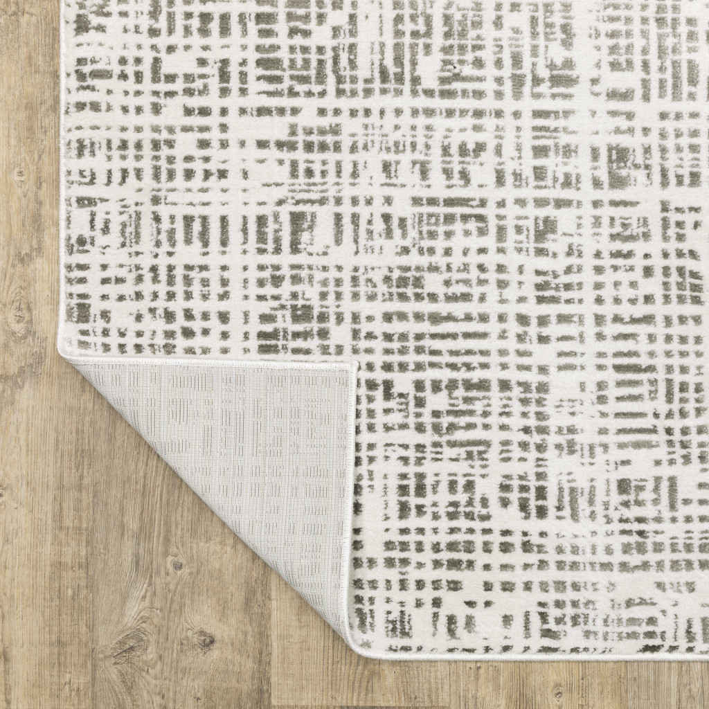 2" X 8" White And Grey Abstract Power Loom Stain Resistant Runner Rug