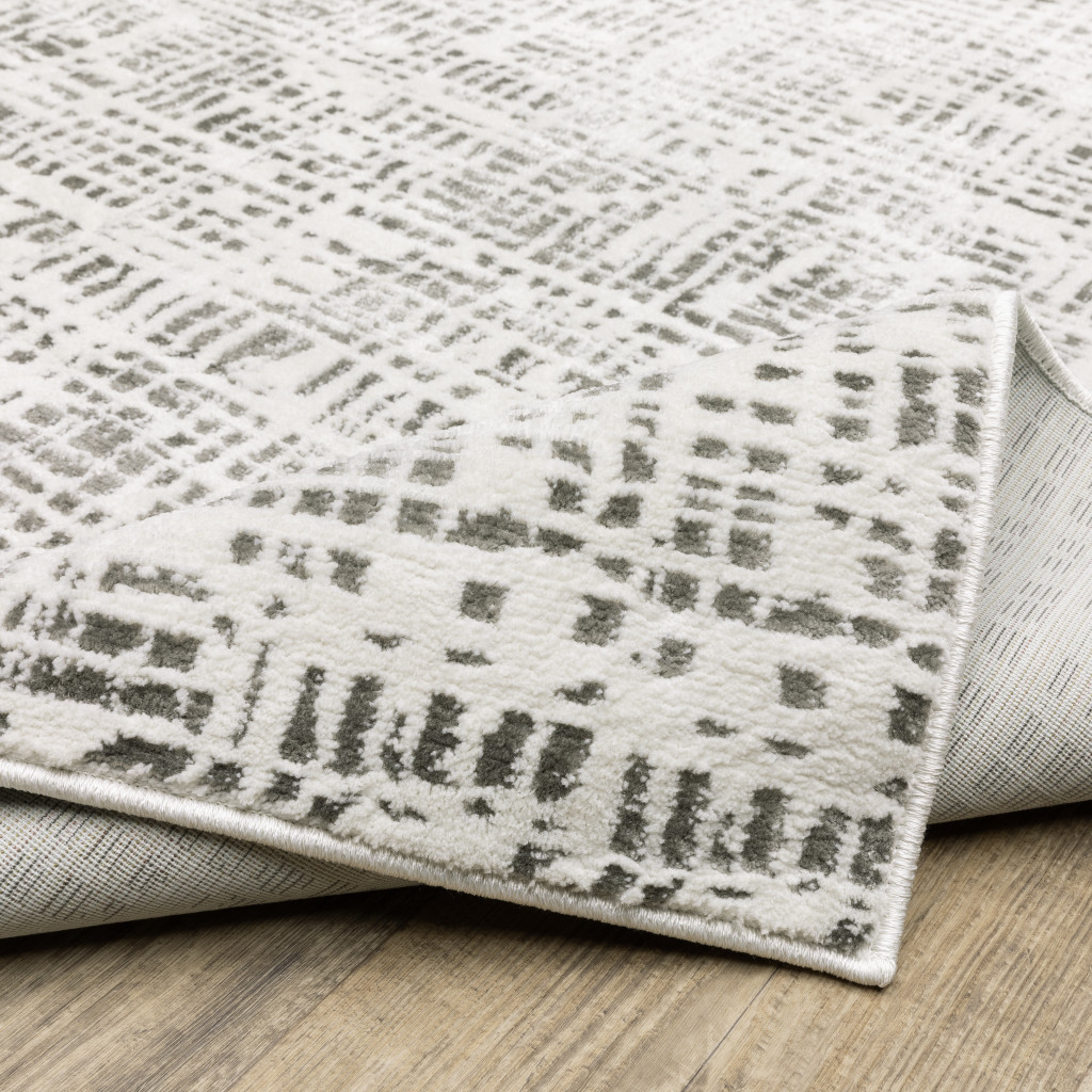 2" X 8" White And Grey Abstract Power Loom Stain Resistant Runner Rug