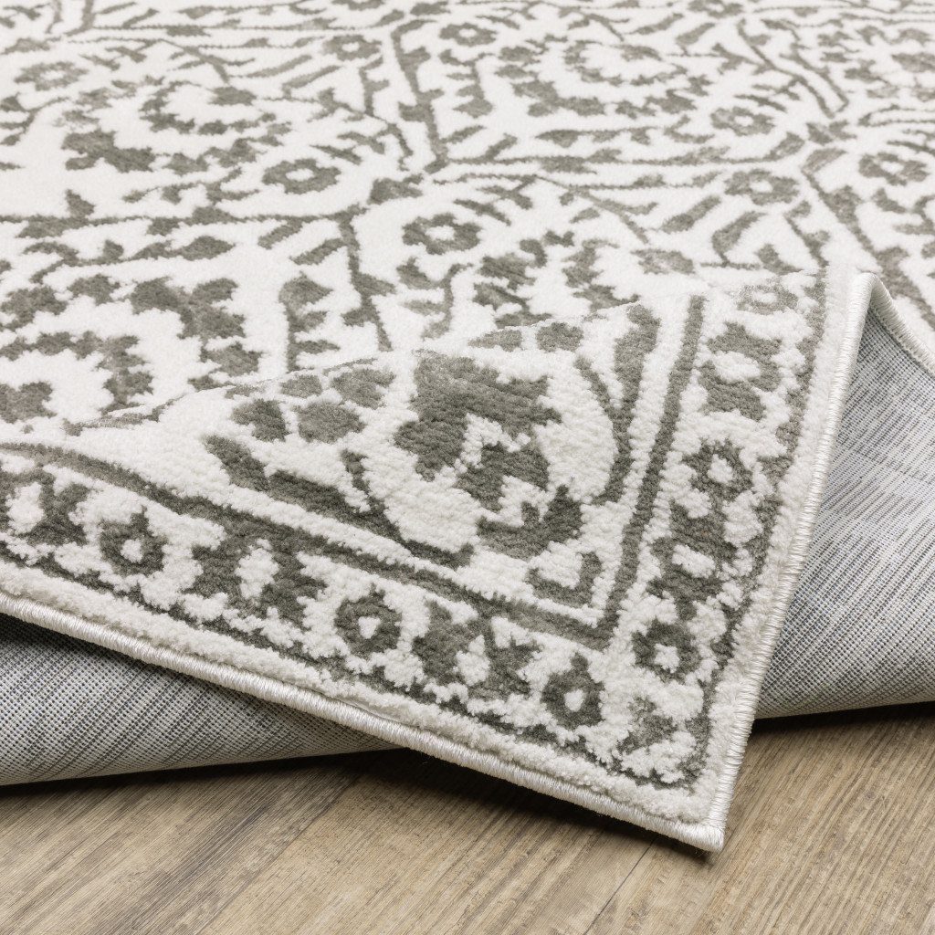 2" X 8" Grey And White Floral Power Loom Stain Resistant Runner Rug