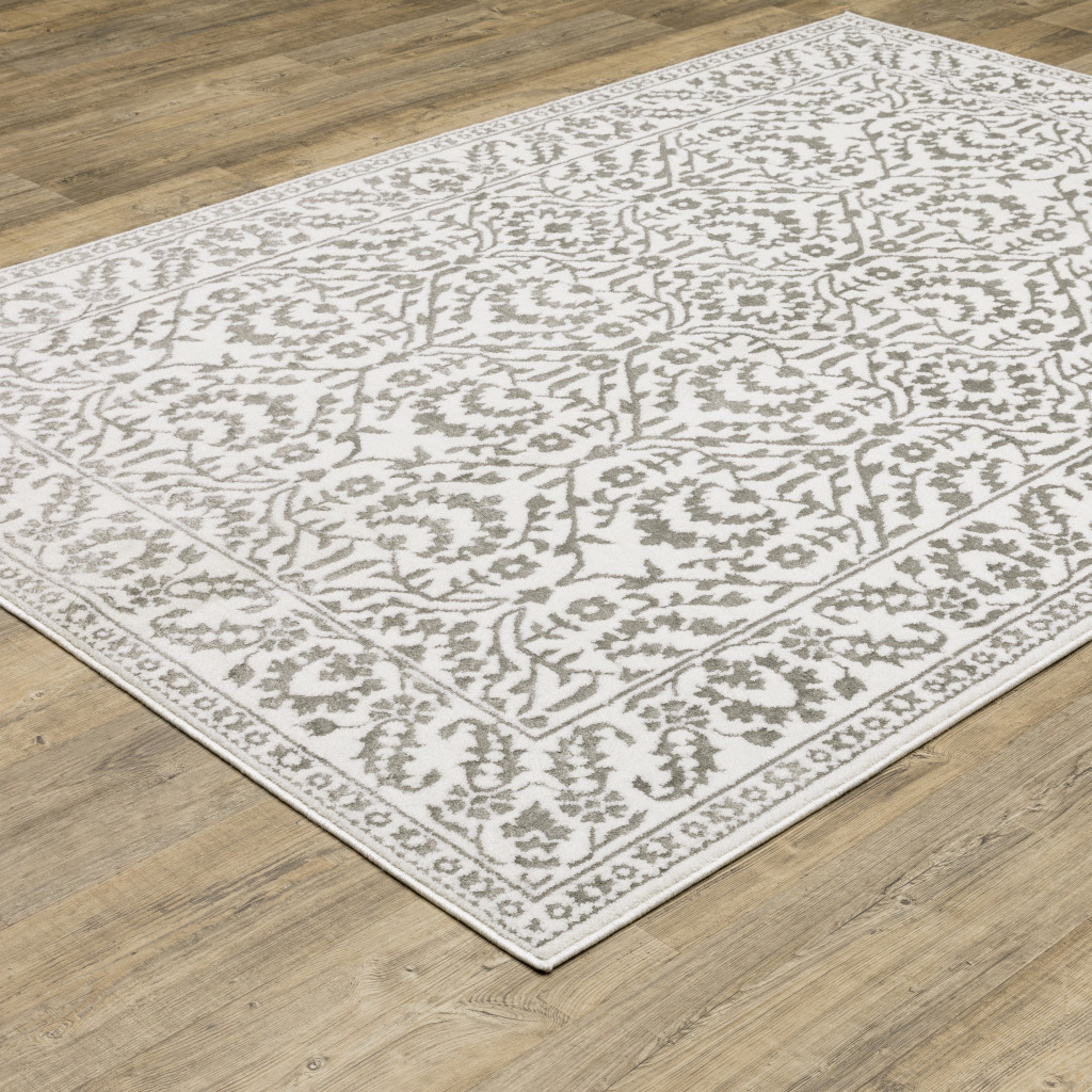 7" X 10" Gray and White Floral Power Loom Area Rug