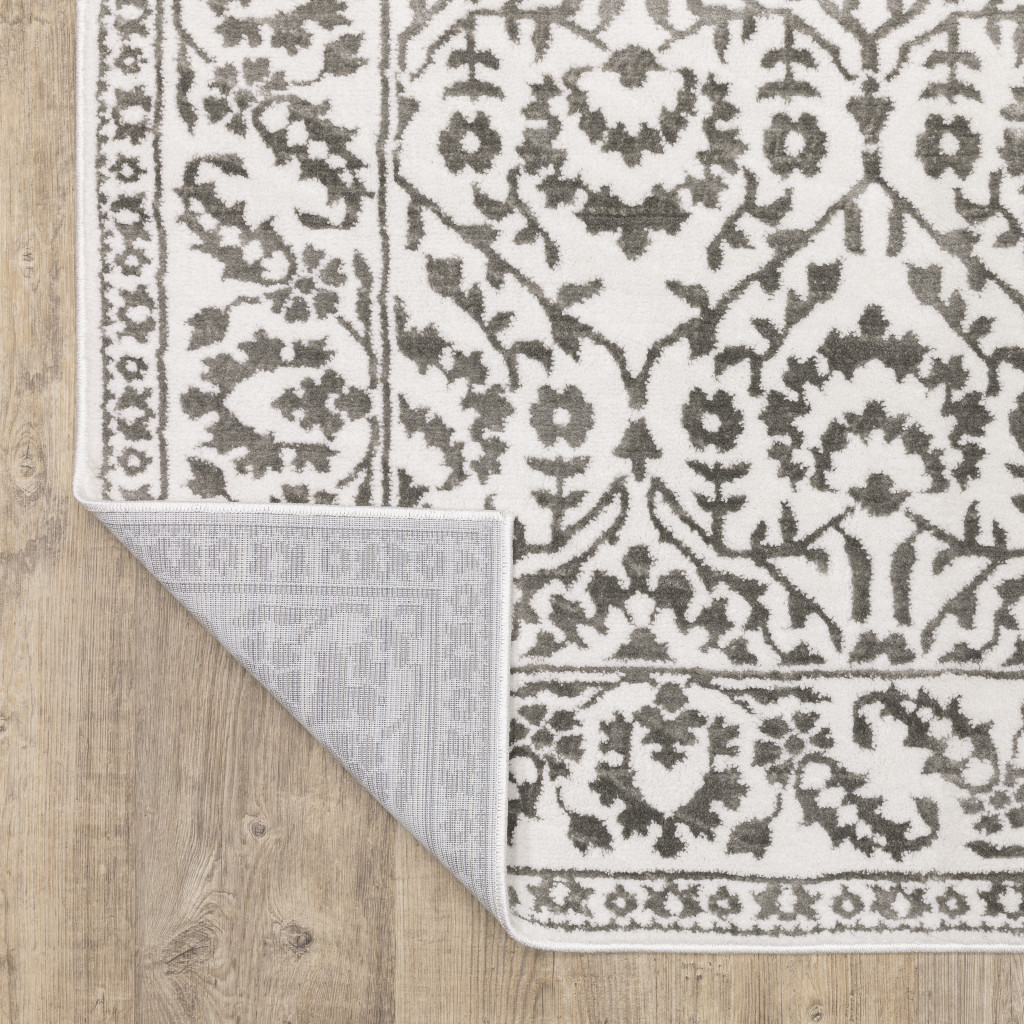 7" X 10" Gray and White Floral Power Loom Area Rug