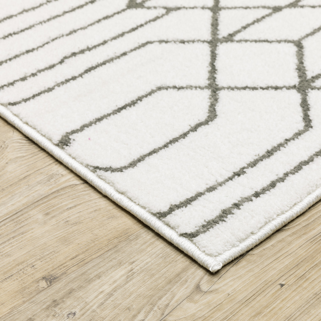 2" X 8" White And Grey Geometric Power Loom Stain Resistant Runner Rug