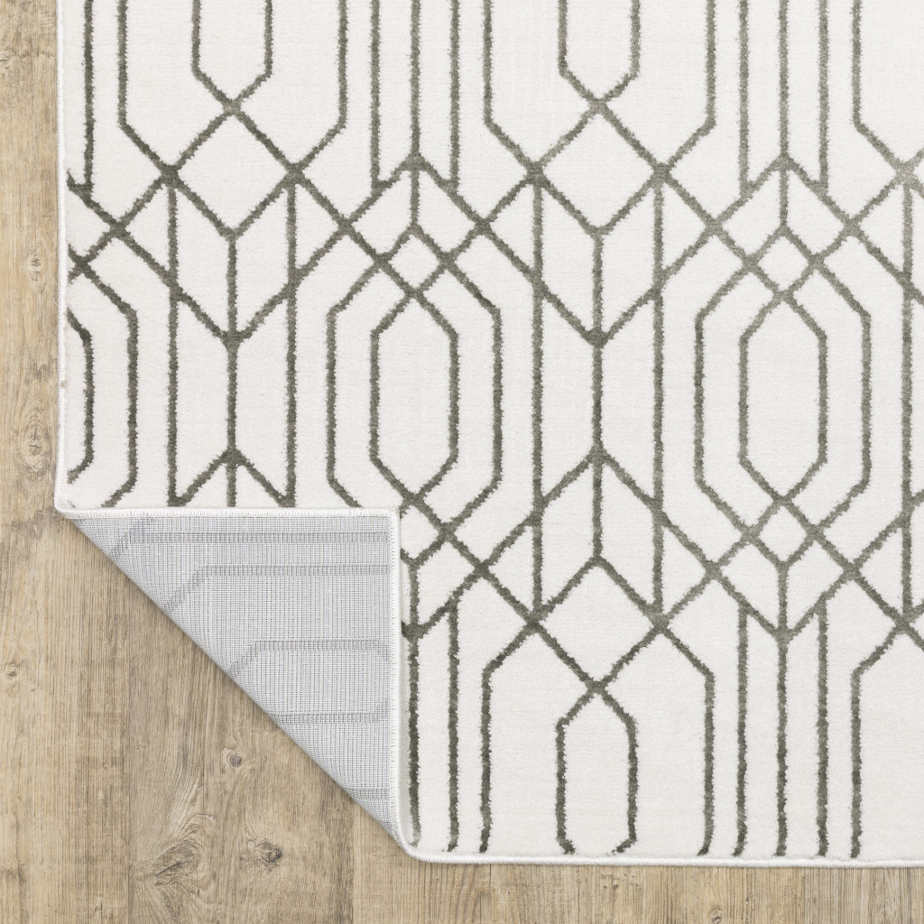 2" X 8" White And Grey Geometric Power Loom Stain Resistant Runner Rug
