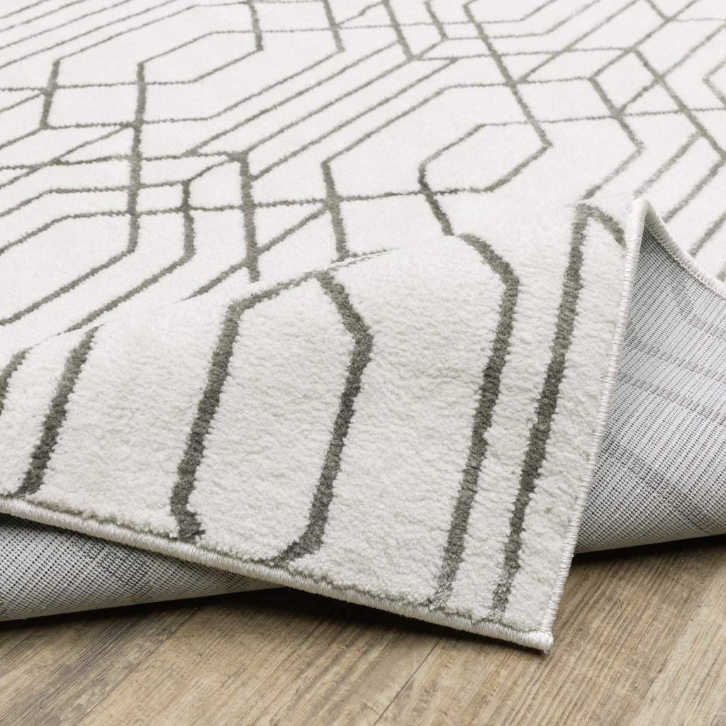2" X 8" White And Grey Geometric Power Loom Stain Resistant Runner Rug