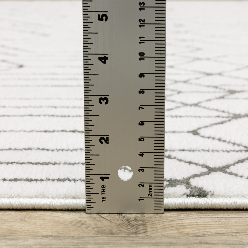 2" X 8" White And Grey Geometric Power Loom Stain Resistant Runner Rug
