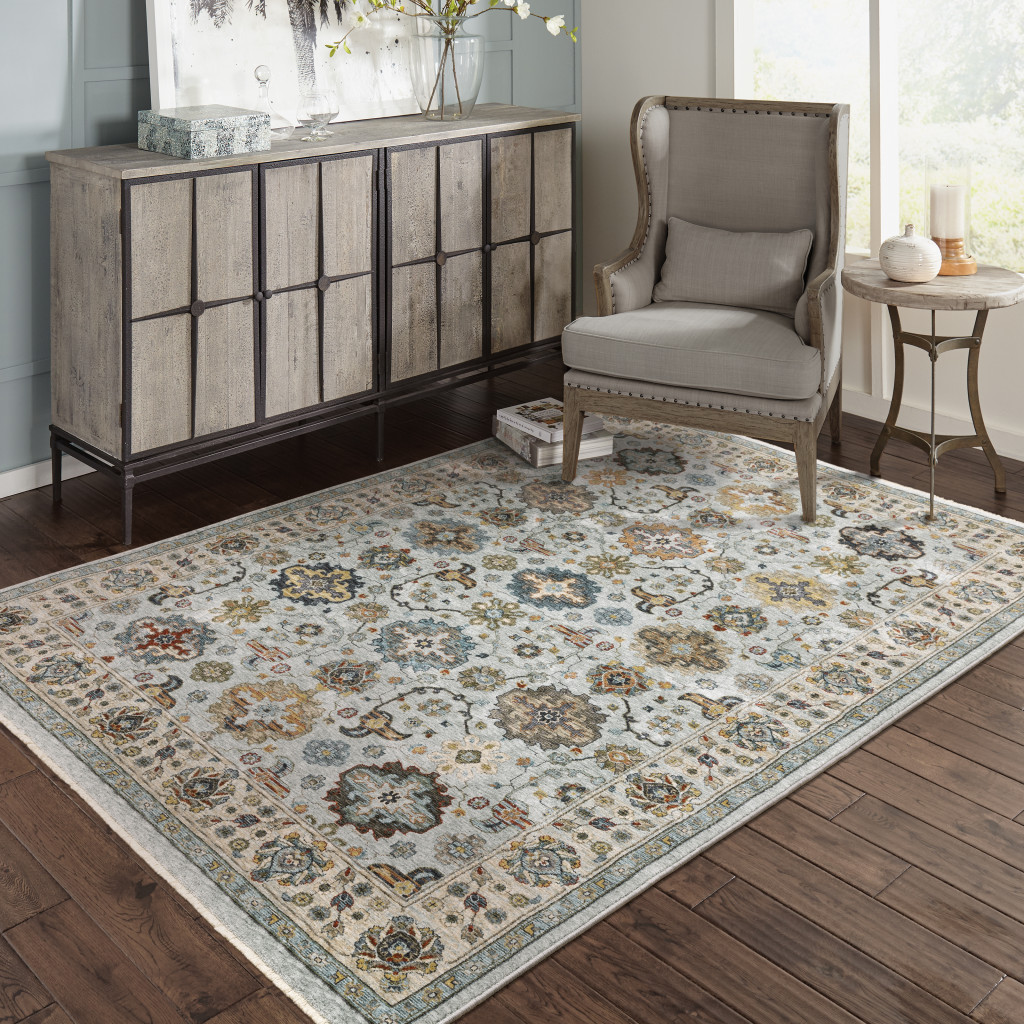 5" X 8" Blue Beige Grey Green Yellow And Rust Oriental Power Loom Stain Resistant Area Rug With Fringe