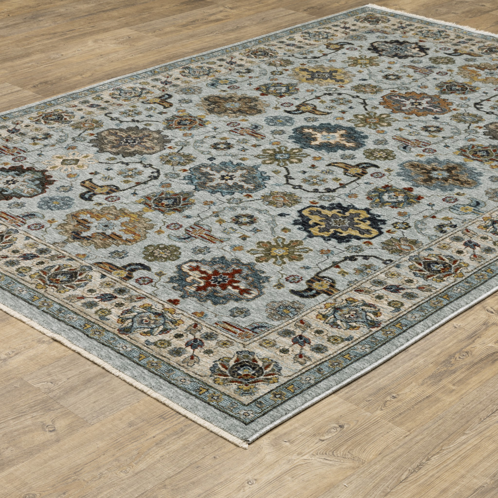 5" X 8" Blue Beige Grey Green Yellow And Rust Oriental Power Loom Stain Resistant Area Rug With Fringe