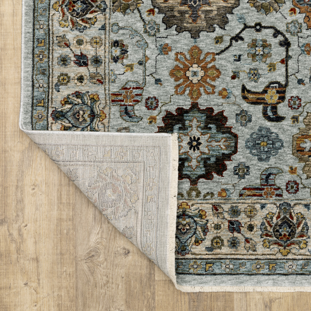 5" X 8" Blue Beige Grey Green Yellow And Rust Oriental Power Loom Stain Resistant Area Rug With Fringe