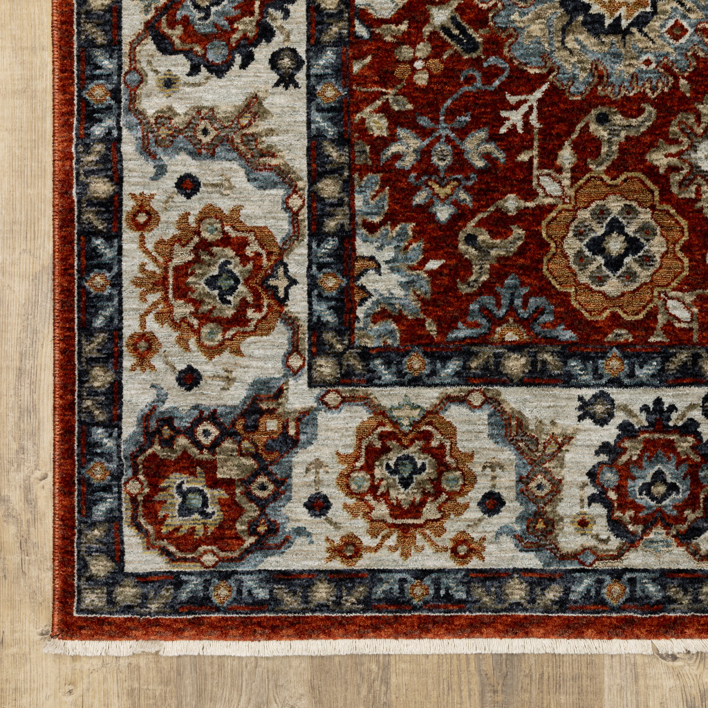 2 X 3 Red Blue Ivory gold And Navy Oriental Power Loom Stain Resistant Area Rug With Fringe