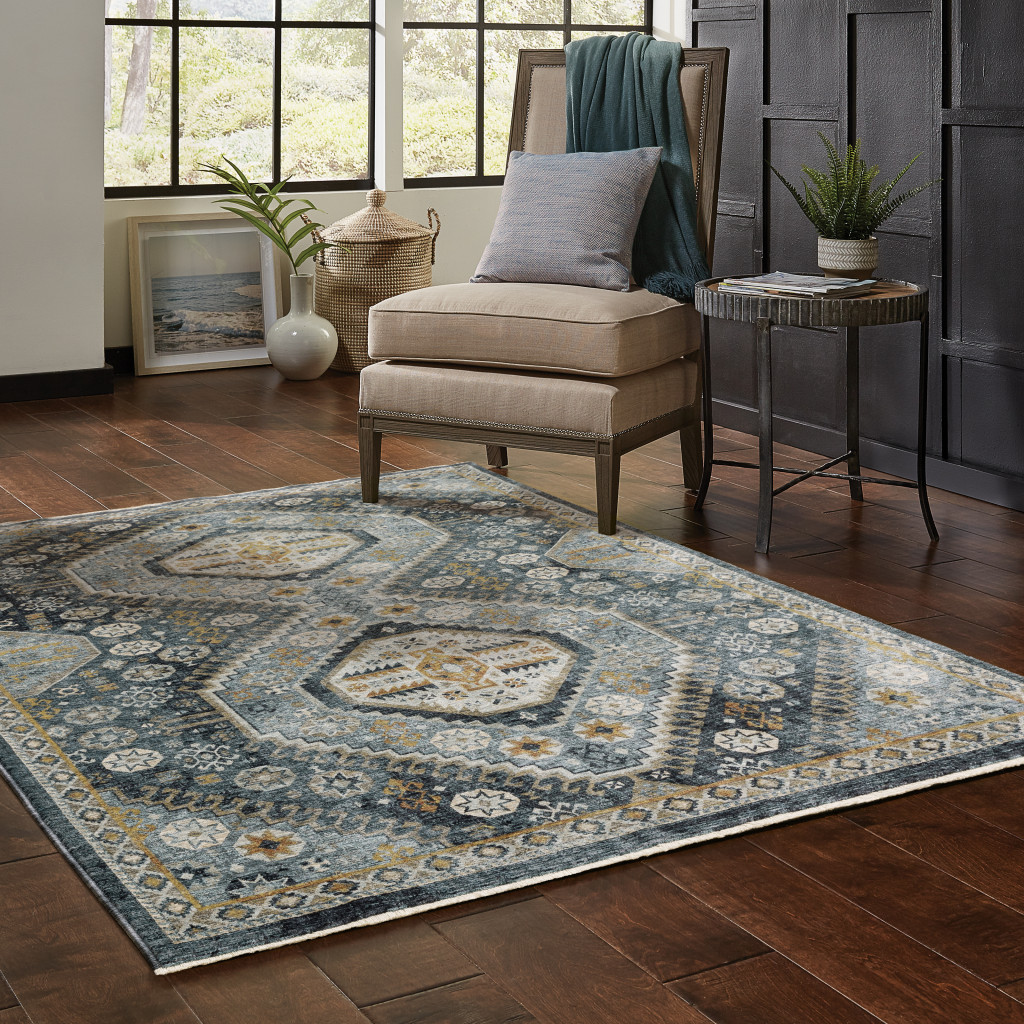 10" X 13" Blue Gold Ivory And Navy Oriental Power Loom Stain Resistant Area Rug With Fringe