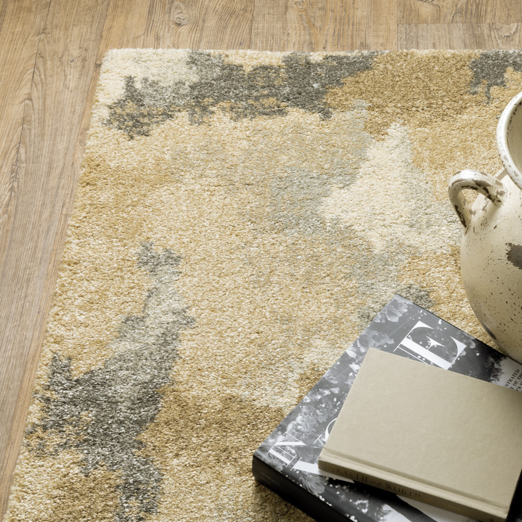 5" X 8" Beige Grey And Gold Abstract Power Loom Stain Resistant Area Rug