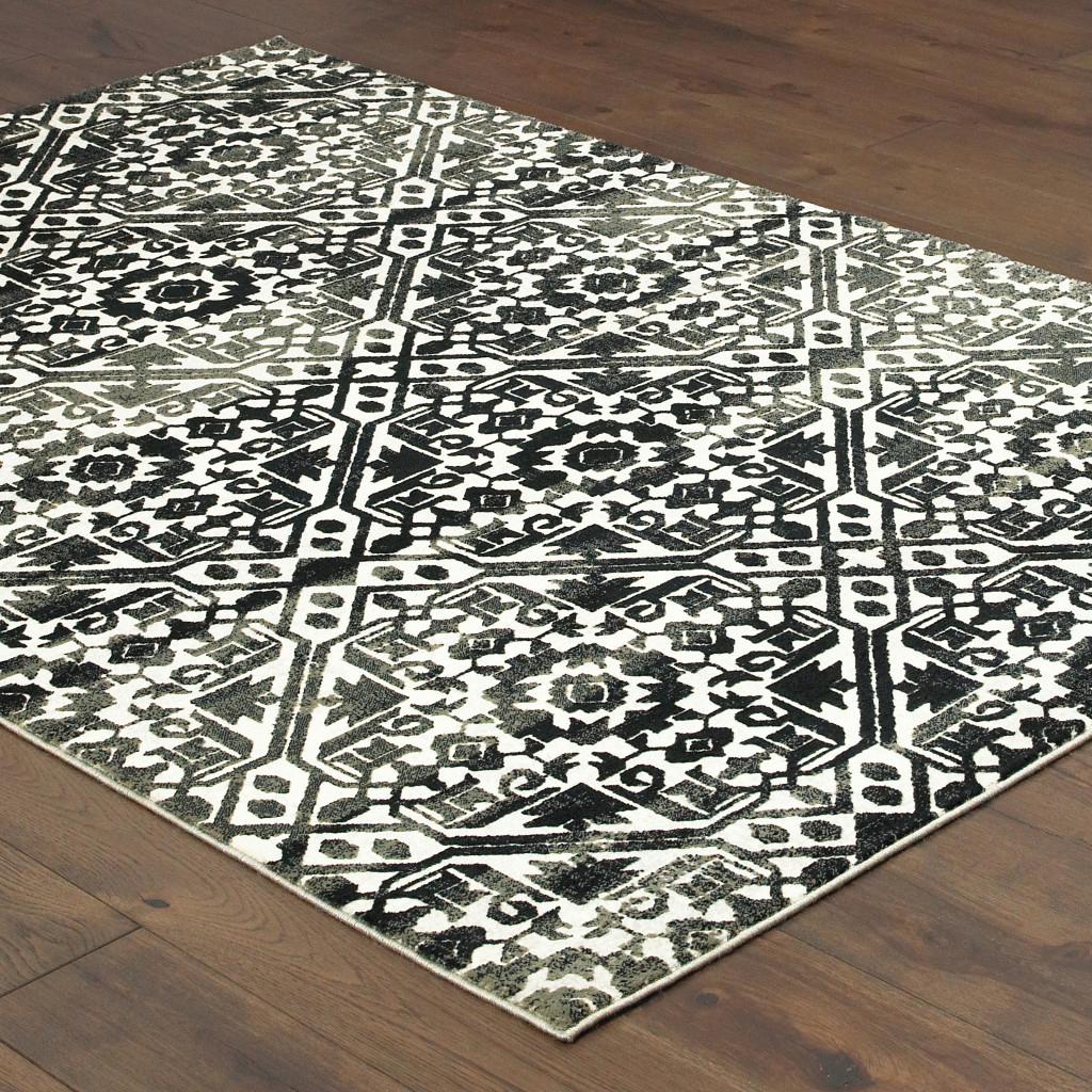 8" X 11" Navy And Ivory Geometric Power Loom Stain Resistant Area Rug