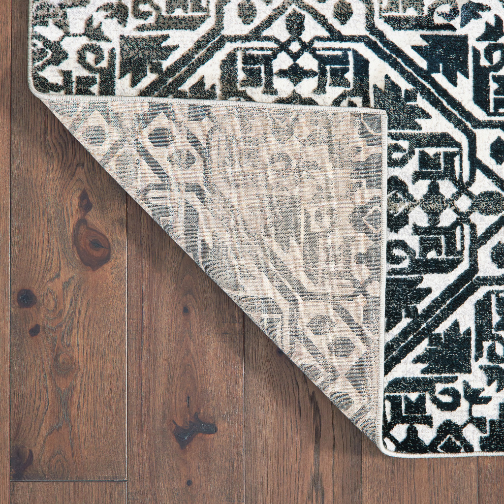 8" X 11" Navy And Ivory Geometric Power Loom Stain Resistant Area Rug