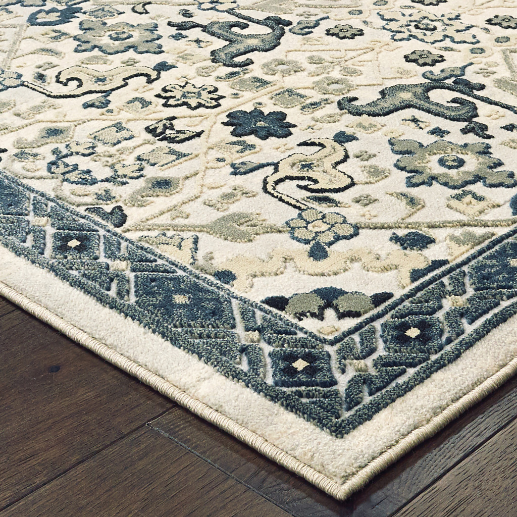 4" X 6" Ivory Navy And Gold Oriental Power Loom Stain Resistant Area Rug