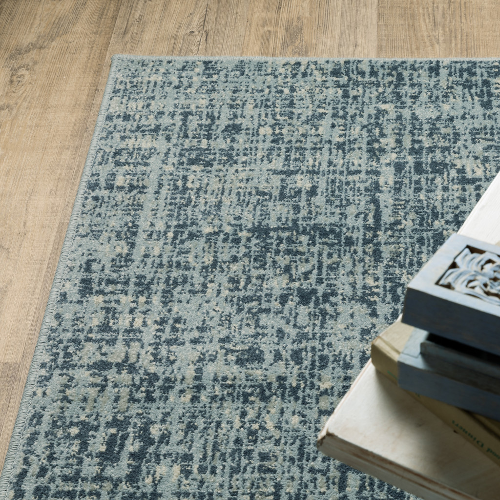 5" X 7" Dark Blue Light Blue Grey Ivory And Beige Abstract Power Loom Stain Resistant Area Rug