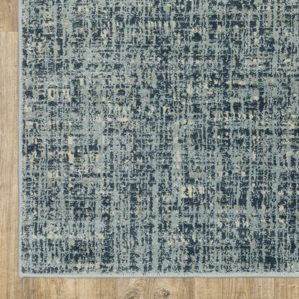 5" X 7" Dark Blue Light Blue Grey Ivory And Beige Abstract Power Loom Stain Resistant Area Rug