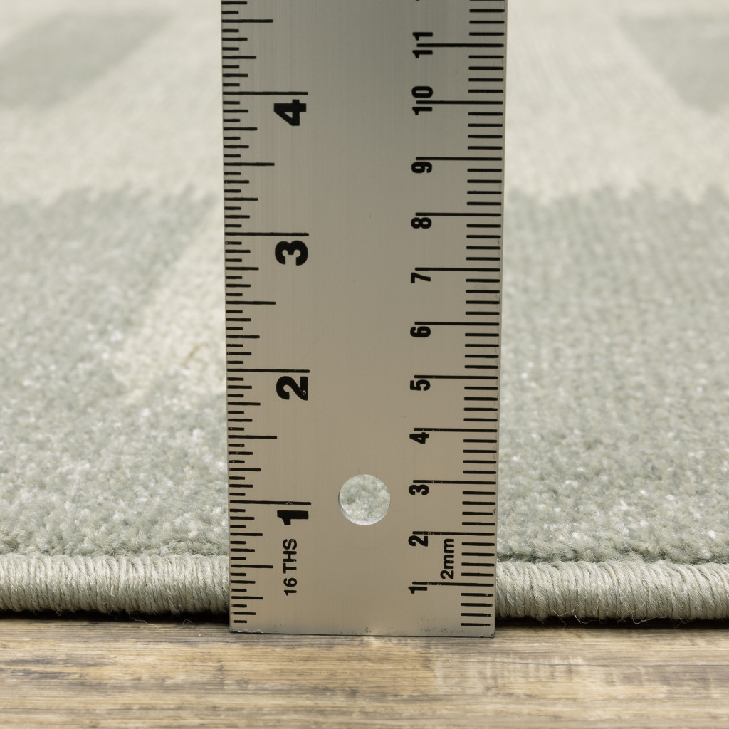3" X 5" Beige Grey Gold And Green Geometric Power Loom Stain Resistant Area Rug