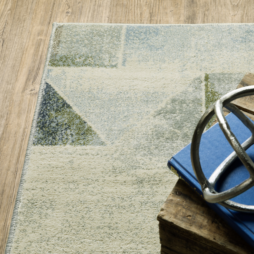 3" X 5" Blue Green Grey Gold And Ivory Geometric Power Loom Stain Resistant Area Rug