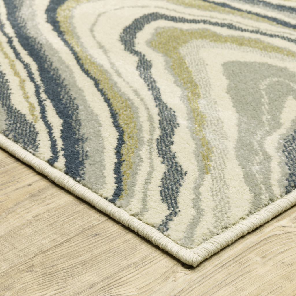 3" X 5" Ivory Blue And Beige Abstract Power Loom Stain Resistant Area Rug