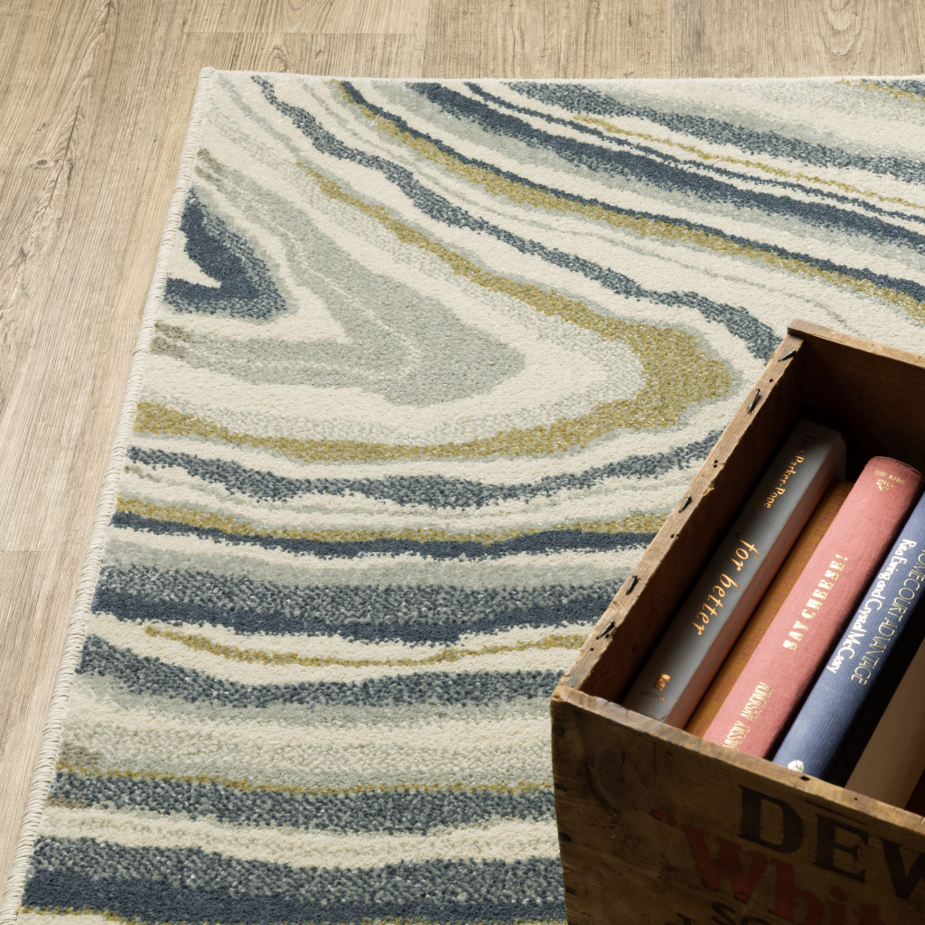 10" X 13" Ivory Blue And Beige Abstract Power Loom Stain Resistant Area Rug