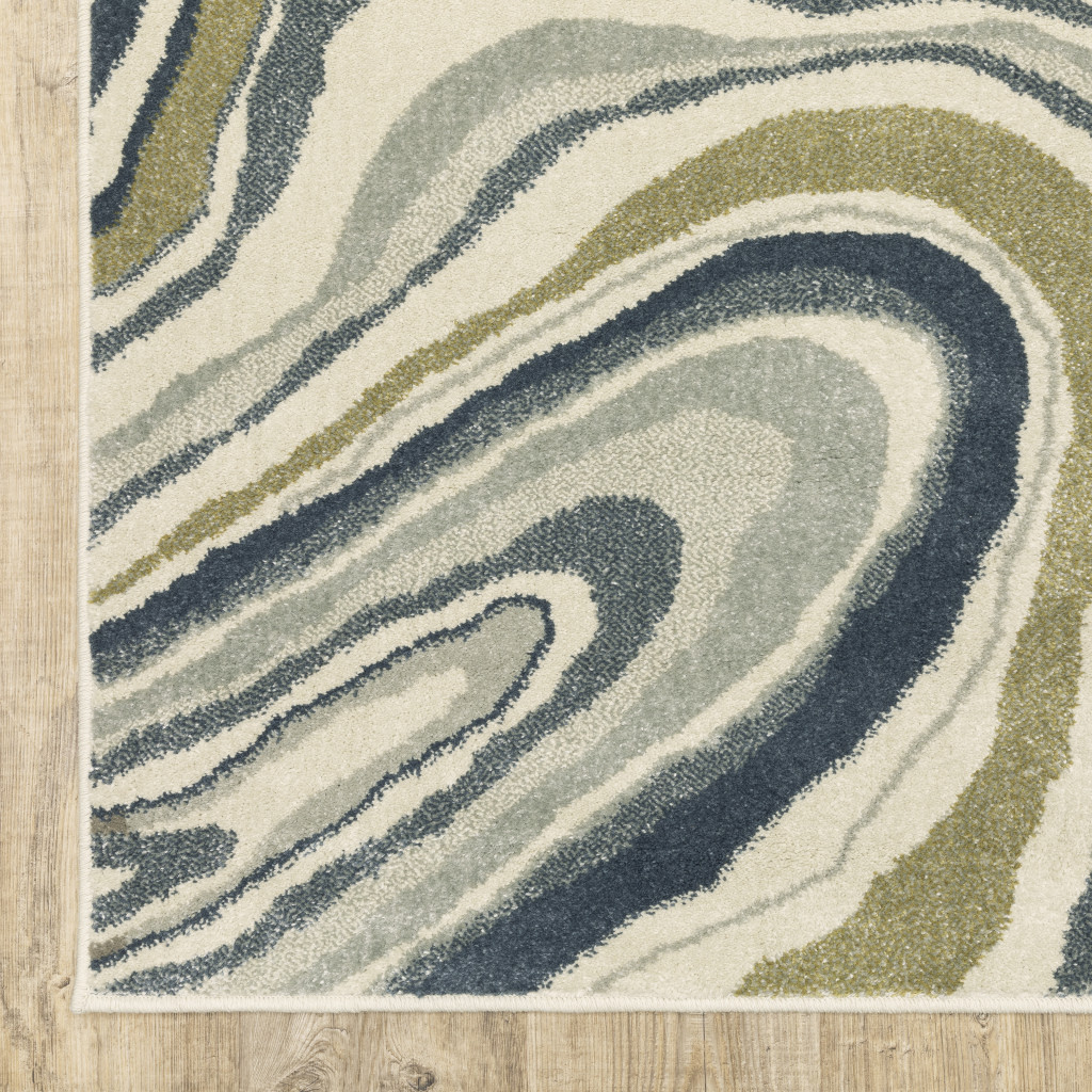 10" X 13" Ivory Blue And Beige Abstract Power Loom Stain Resistant Area Rug