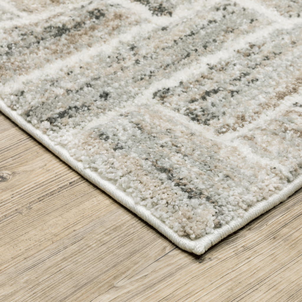 7" X 10" Beige and Ivory Geometric Power Loom Area Rug