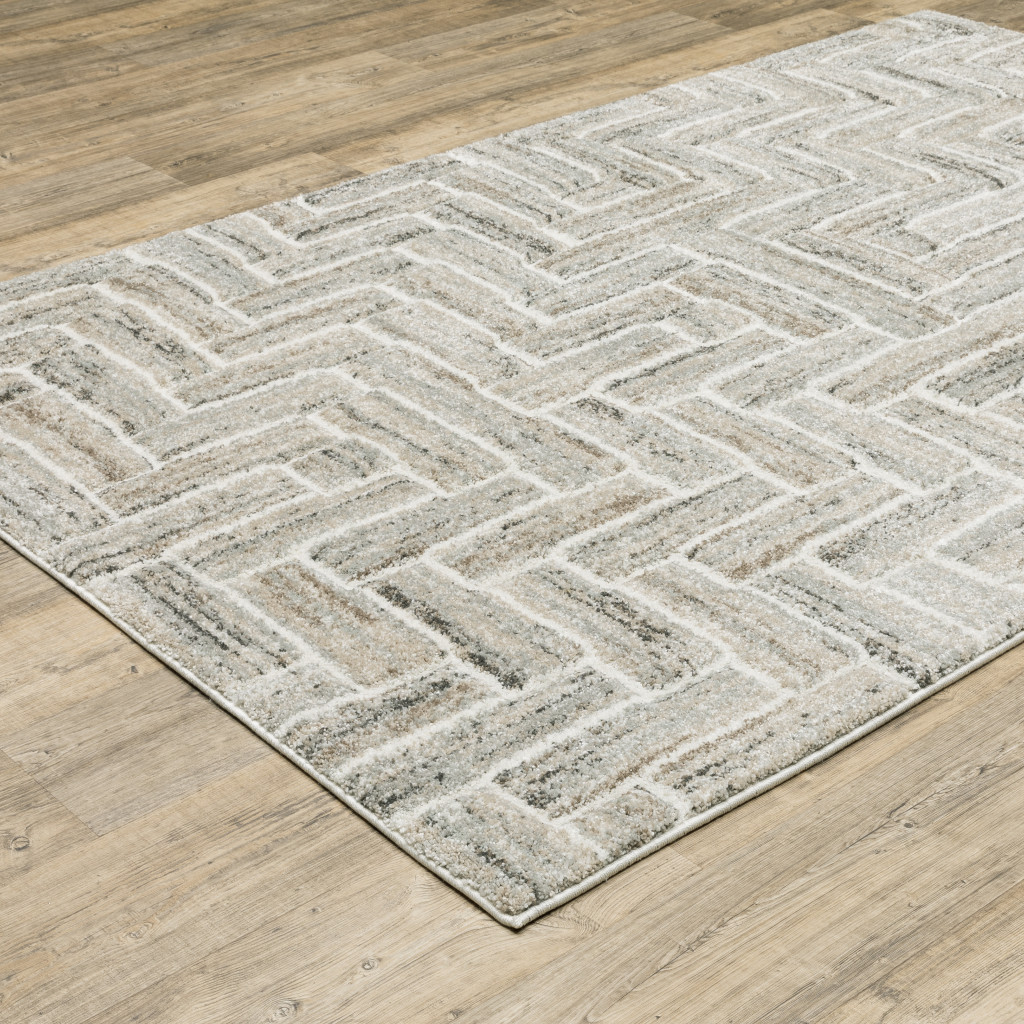 7" X 10" Beige and Ivory Geometric Power Loom Area Rug