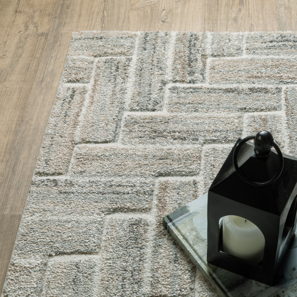 7" X 10" Beige and Ivory Geometric Power Loom Area Rug