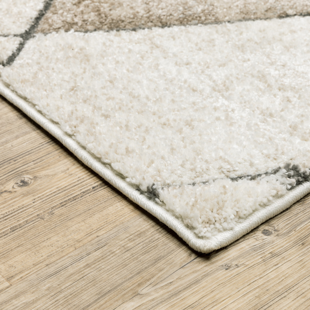 2" X 8" Beige Grey Tan And Brown Geometric Power Loom Stain Resistant Runner Rug
