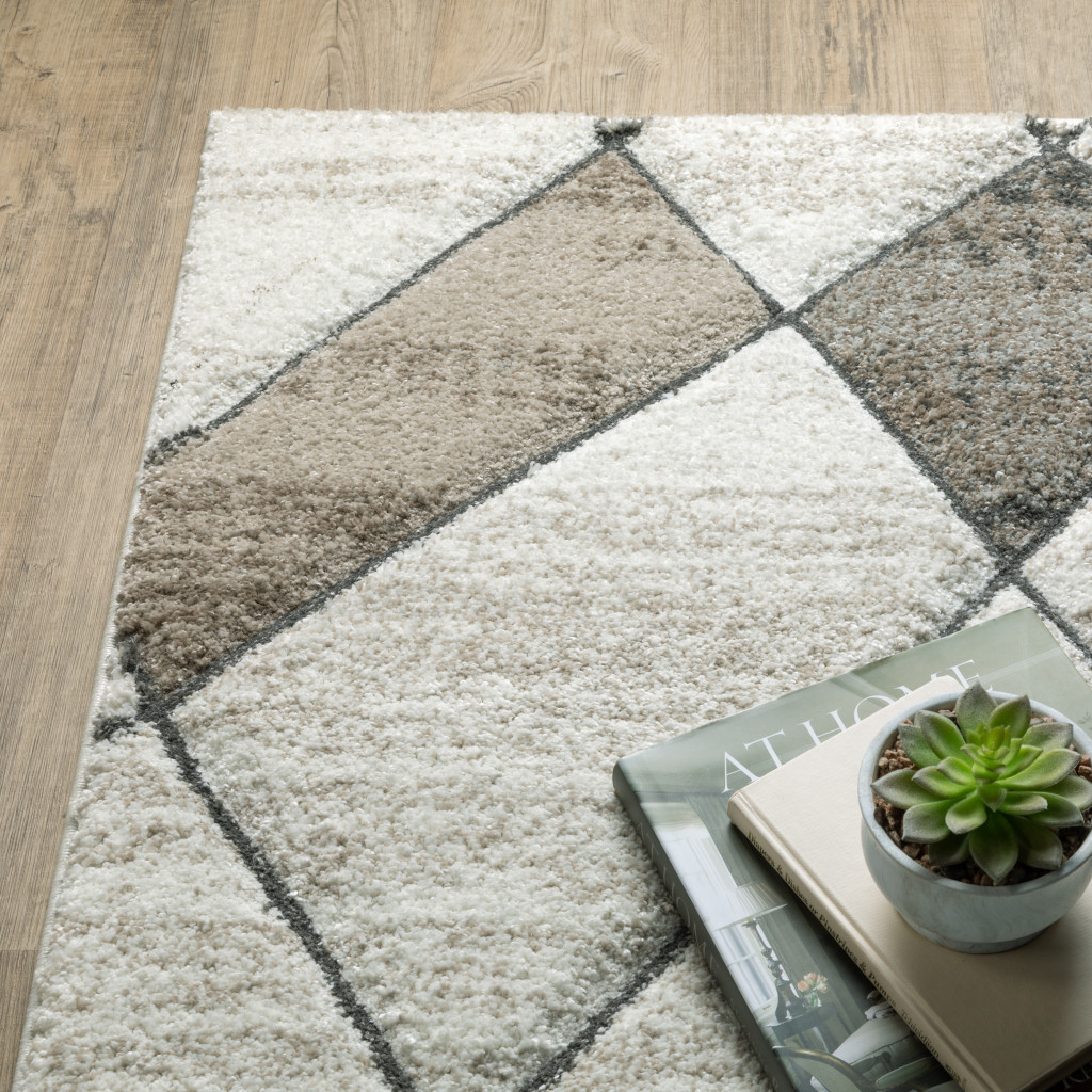 2" X 8" Beige Grey Tan And Brown Geometric Power Loom Stain Resistant Runner Rug