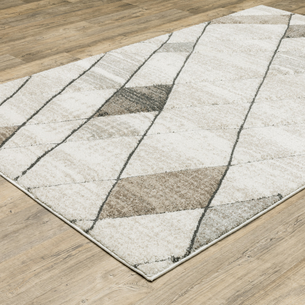 8" X 11" Beige and Black Geometric Power Loom Area Rug