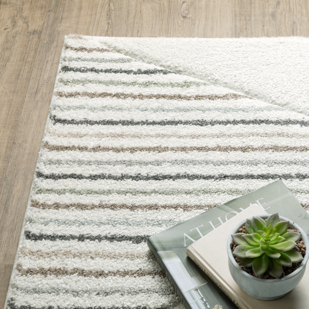 2" X 8" Brown And Ivory Geometric Power Loom Runner Rug