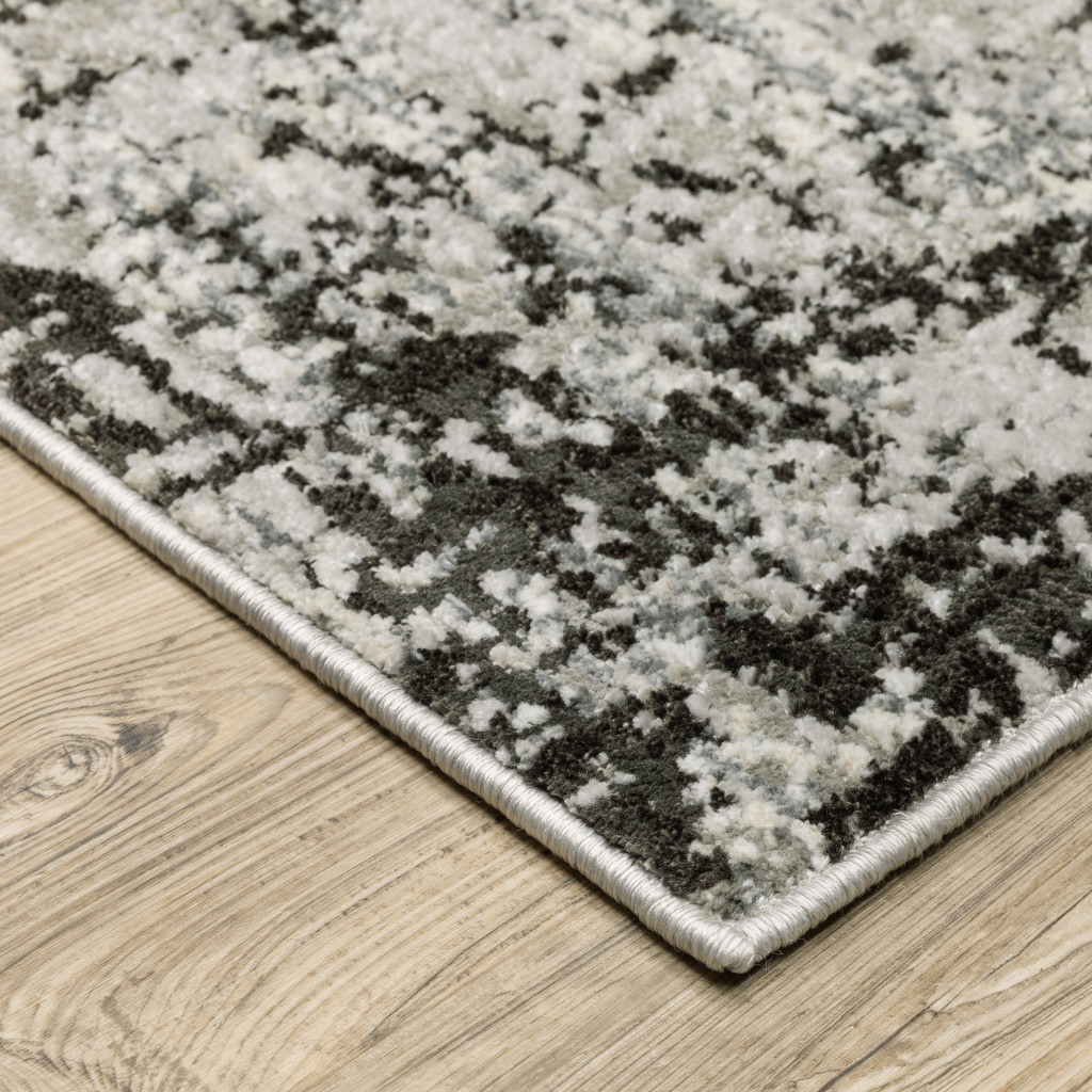7" X 10" Gray and Ivory Abstract Power Loom Area Rug